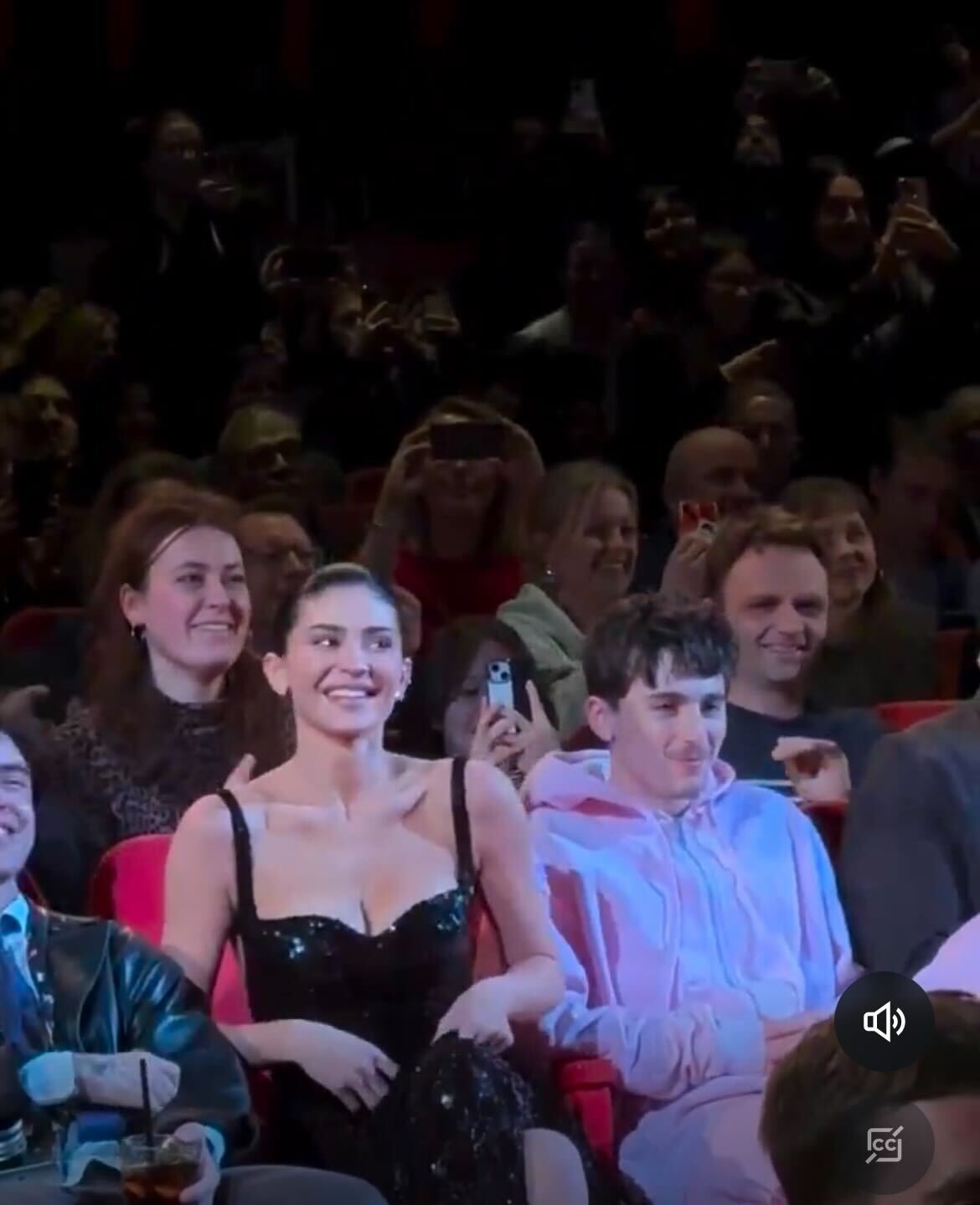 A photo of Kylie Jenner and Timothée Chalamet sitting together in clashing outfits at the Berlin premiere of 'A Complete Unknown.'