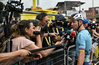 Astana Qazaqstan Team's British rider Mark Cavendish speaks to journalists as he awaits the start of the 3rd stage of the 111th edition of the Tour de France cycling race, 230,5 km between Piacenza and Turin, on July 1, 2024. (Photo by Marco BERTORELLO / AFP)