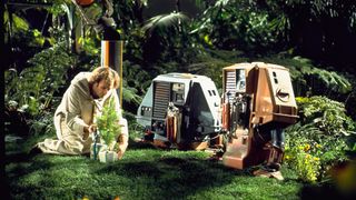 Bruce Dern as Freeman Lowell next to two robots in the sci-fi movie, Silent Running.