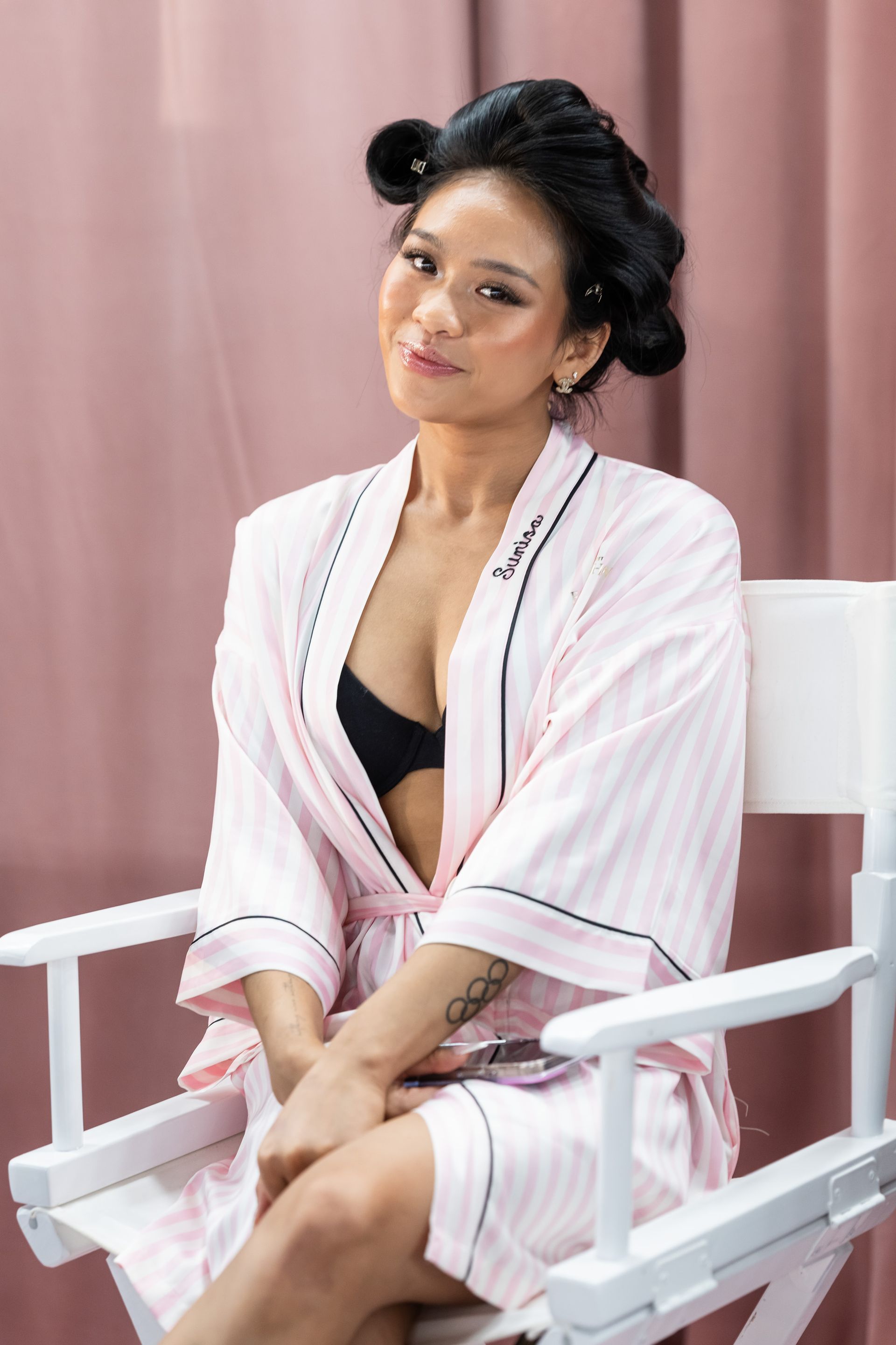 NEW YORK, NEW YORK - OCTOBER 15: Sunisa Lee prepares backstage before the Victoria's Secret Fashion Show at Steiner Studios on October 15, 2025 in New York City.