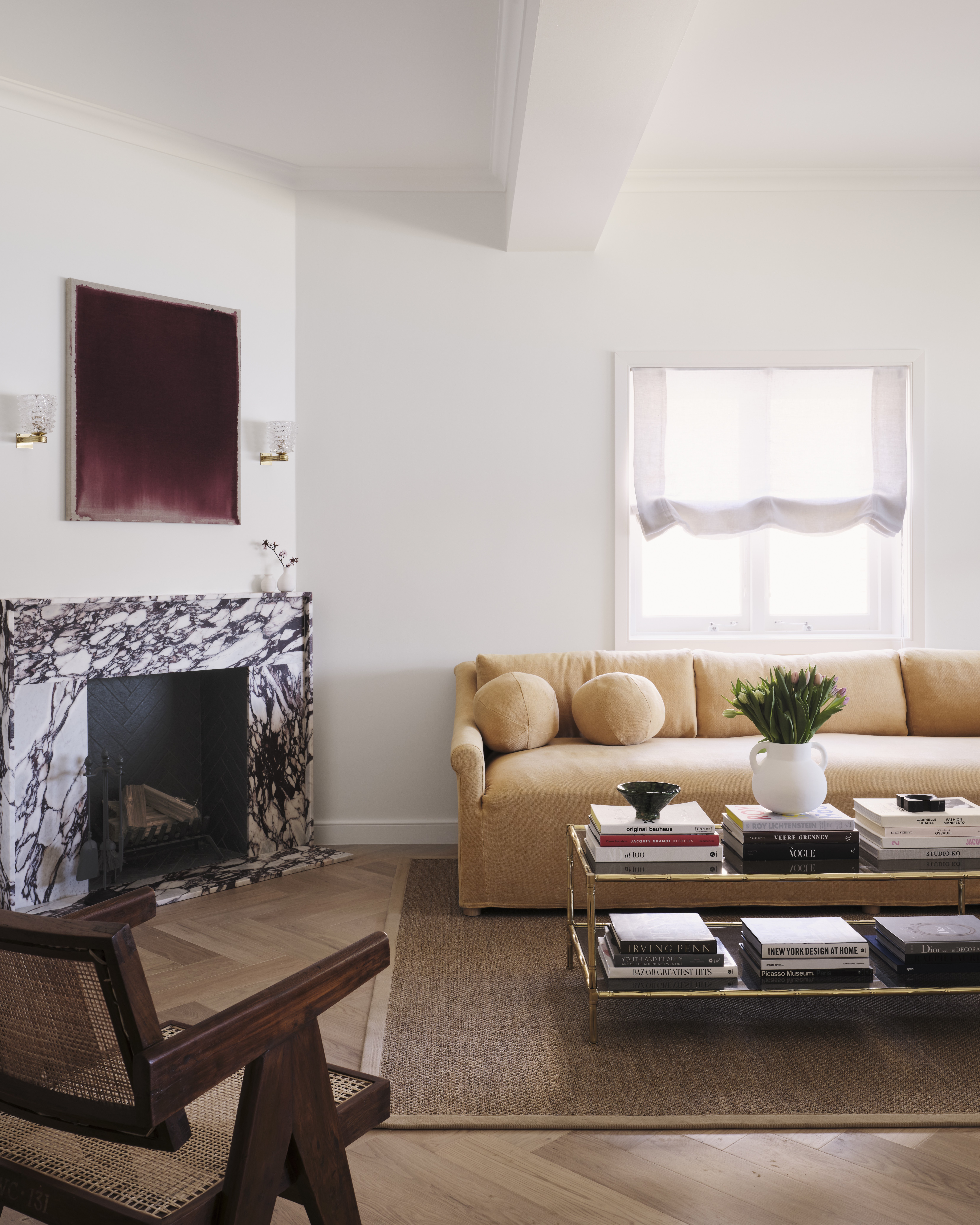 Living room with marble fireplace and yellow sofa