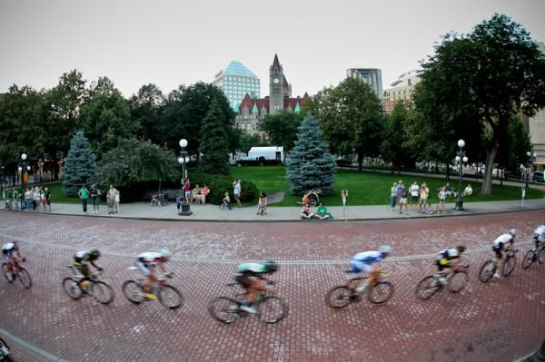 Riders get strung out past a park in downtown St Paul.