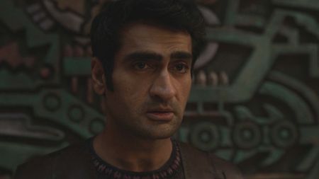 Kumail Nanjiani looking sad in an Eternals flahsback