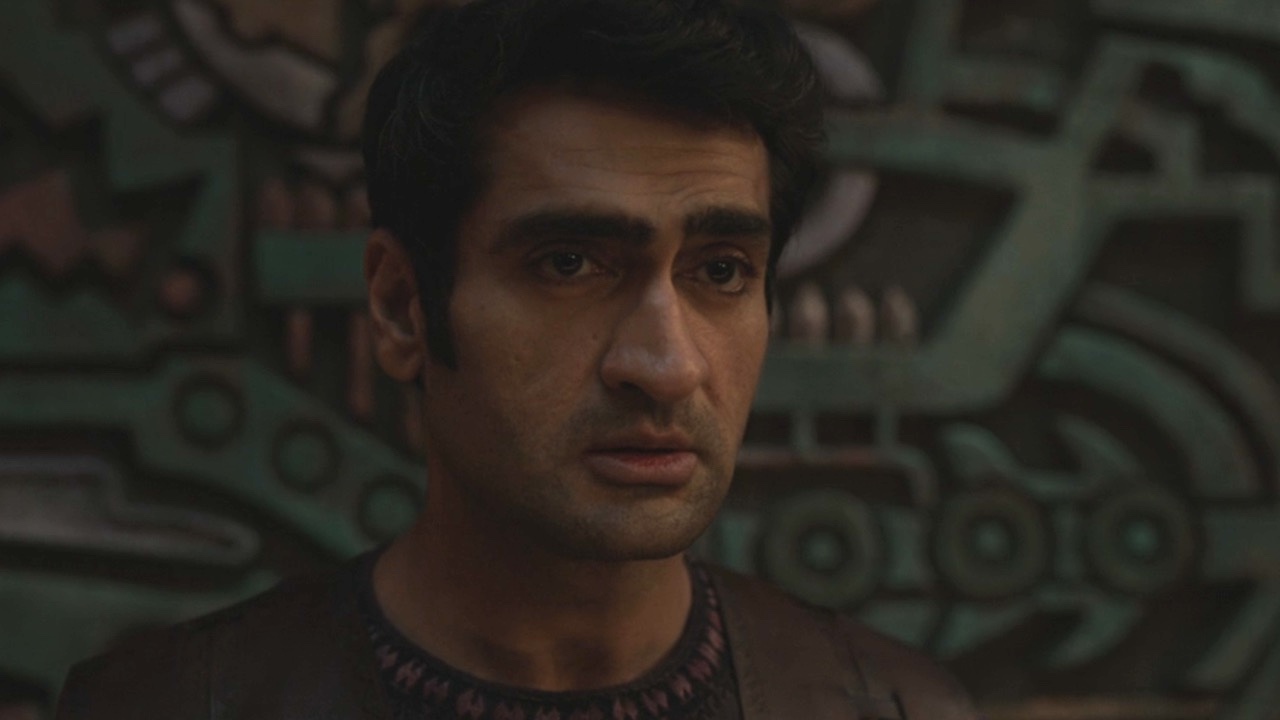 Kumail Nanjiani looking sad in an Eternals flahsback 