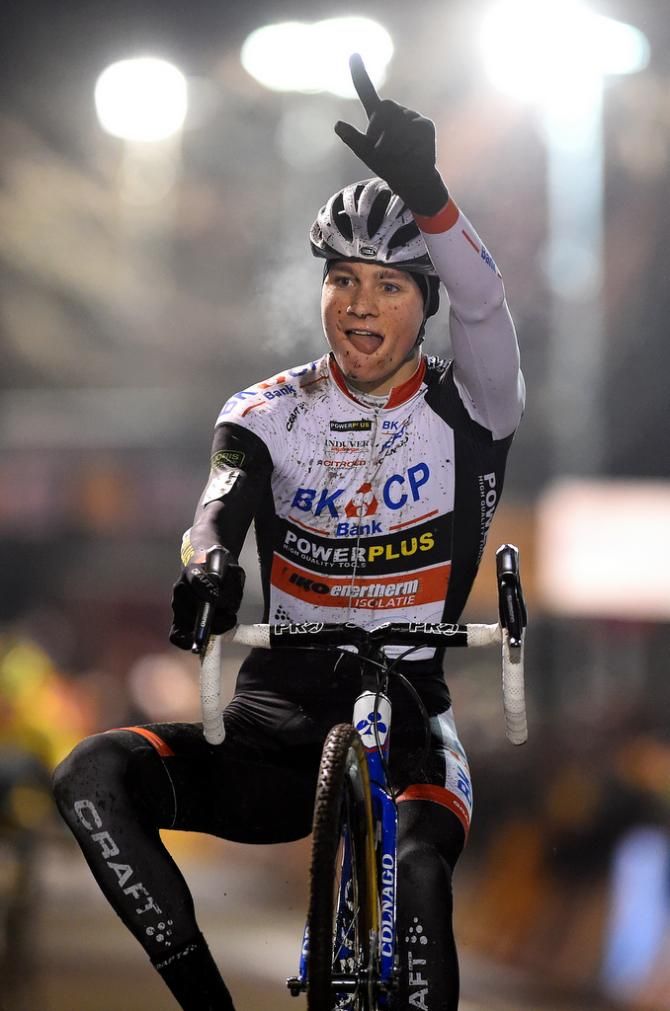 Mathieu van der Poel (BKCP - Powerplus) pops a one handed wheelie over the finish line