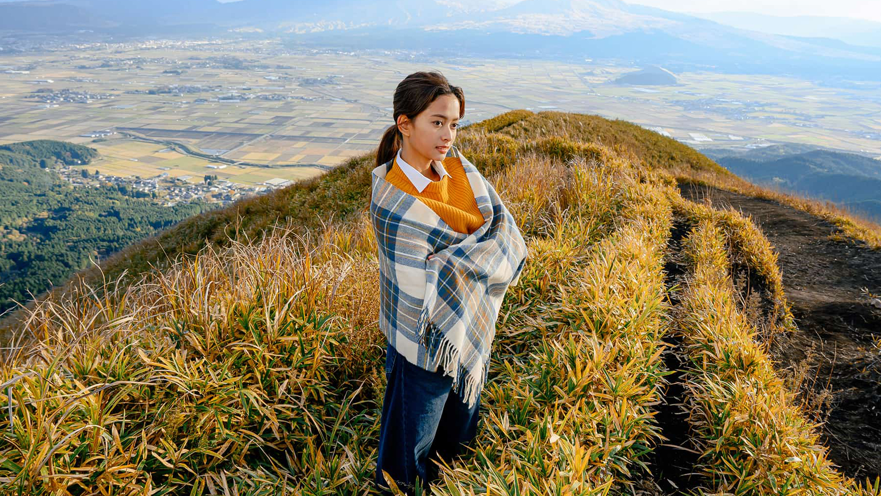 A sample photo of a woman on top of a mountain taken with the Nikon Nikkor Z 24-105mm f/4-7.1 lens