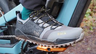 The Fizik Terra Ergolace GTX Flat shoe being worn on a bike