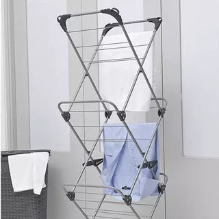 Grey collapsible clothes drying rack with three tiers