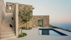tinos house terrace with swimming pool and cats on the stairs