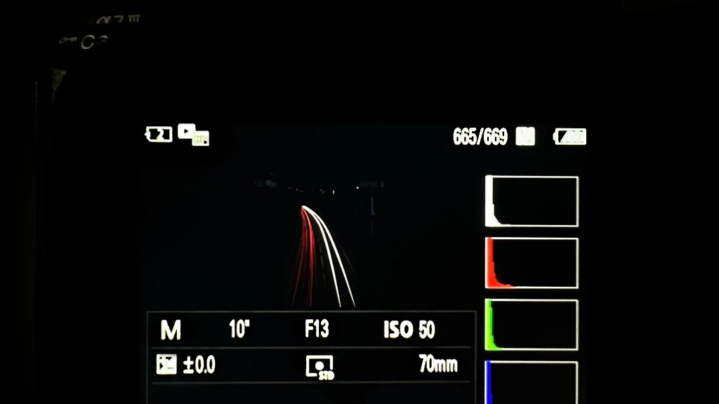Close-up of a Sony camera screen displaying image file with exposure settings and light levels