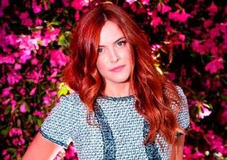Riley Keough poses on the red carpet