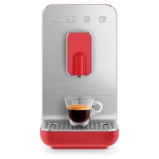 A red and silver espresso machine from Smeg