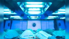 A handful of N95 respirators get zapped with UV radiation.