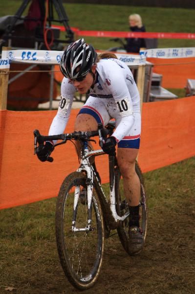 Katie Compton powers away from the field in Nommay.