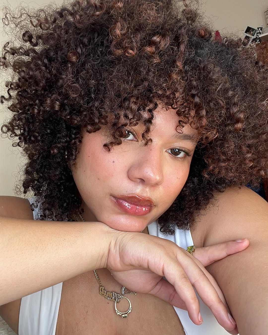 Ana Rivera shows off her even-toned complexion and bouncy curls