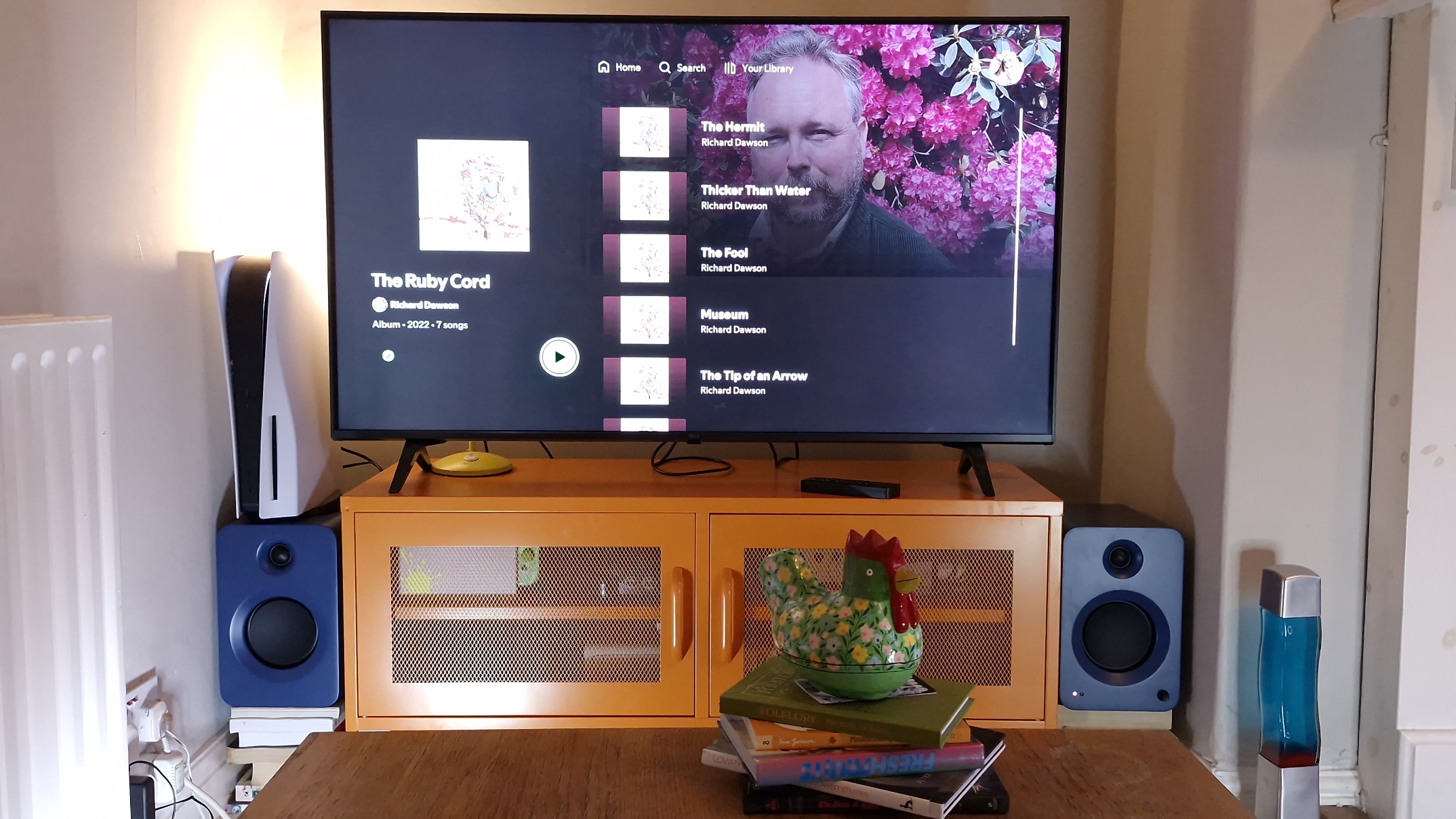 Kanto Ren speakers in blue, within a hi-fi listening room