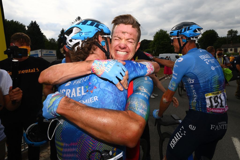 IsraelPremier Tech teams Australian rider Simon Clarke C celebrates with IsraelPremier Tech teams British rider Chris Froome L and teammates after winning the 5th stage of the 109th edition of the Tour de France cycling race 1537 km between Lille and Arenberg Porte du Hainaut in northern France on July 6 2022 Photo by Tim De Waele AFP Photo by TIM DE WAELEAFP via Getty Images