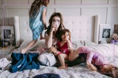 mum with kids on bed