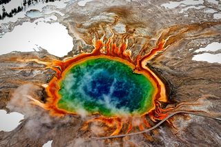 A supervolcano beneath Yellowstone is what drives the hot springs, such as the Grand Prismatic Spring (shown here) and other geological activity in the park.