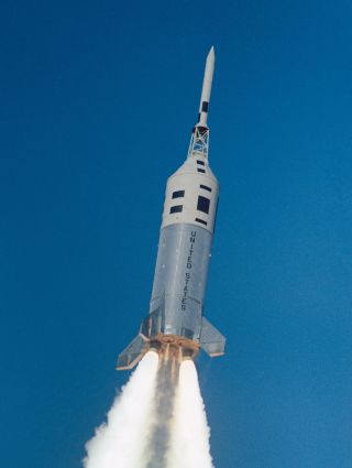 An Apollo command module boilerplate launches on a Little Joe II in-flight abort test on December 8, 1964. The third of five Little Joe II tests, the abort mimicked the conditions atop a Saturn V.