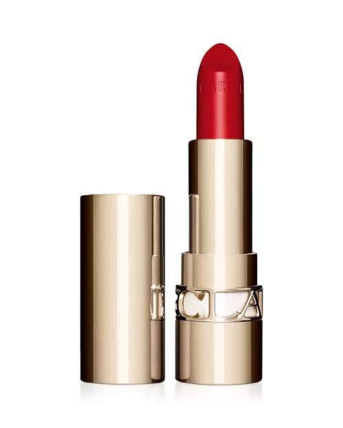 A gold tube of red Clarins lipstick 