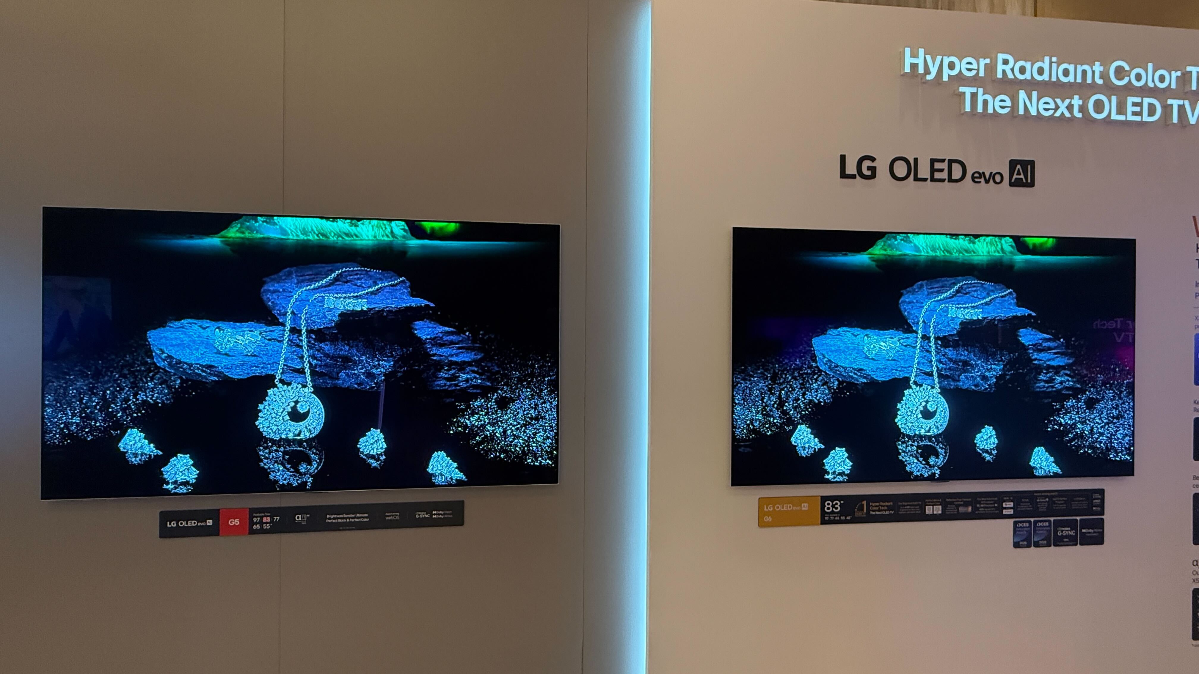 A wall mounted LG G6 OLED TV with LG demo content on screen
