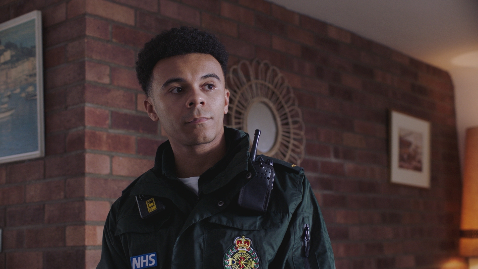 Teddy in his paramedic uniform at work in someone's living room.