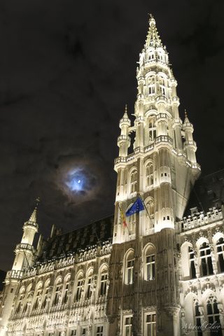 A colorful lunar corona above Grand Place, in Brussels city, Belgium, in this image by sky photographer Miguel Claro.