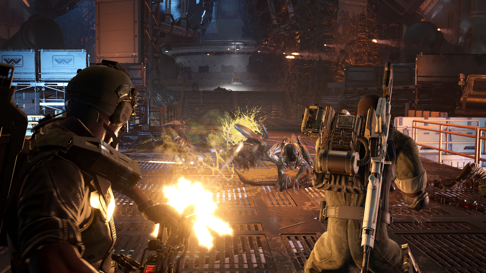 Two armored soldiers in a dimly lit industrial sci-fi fire weapons at approaching alien creatures. The scene conveys intense action and urgency.