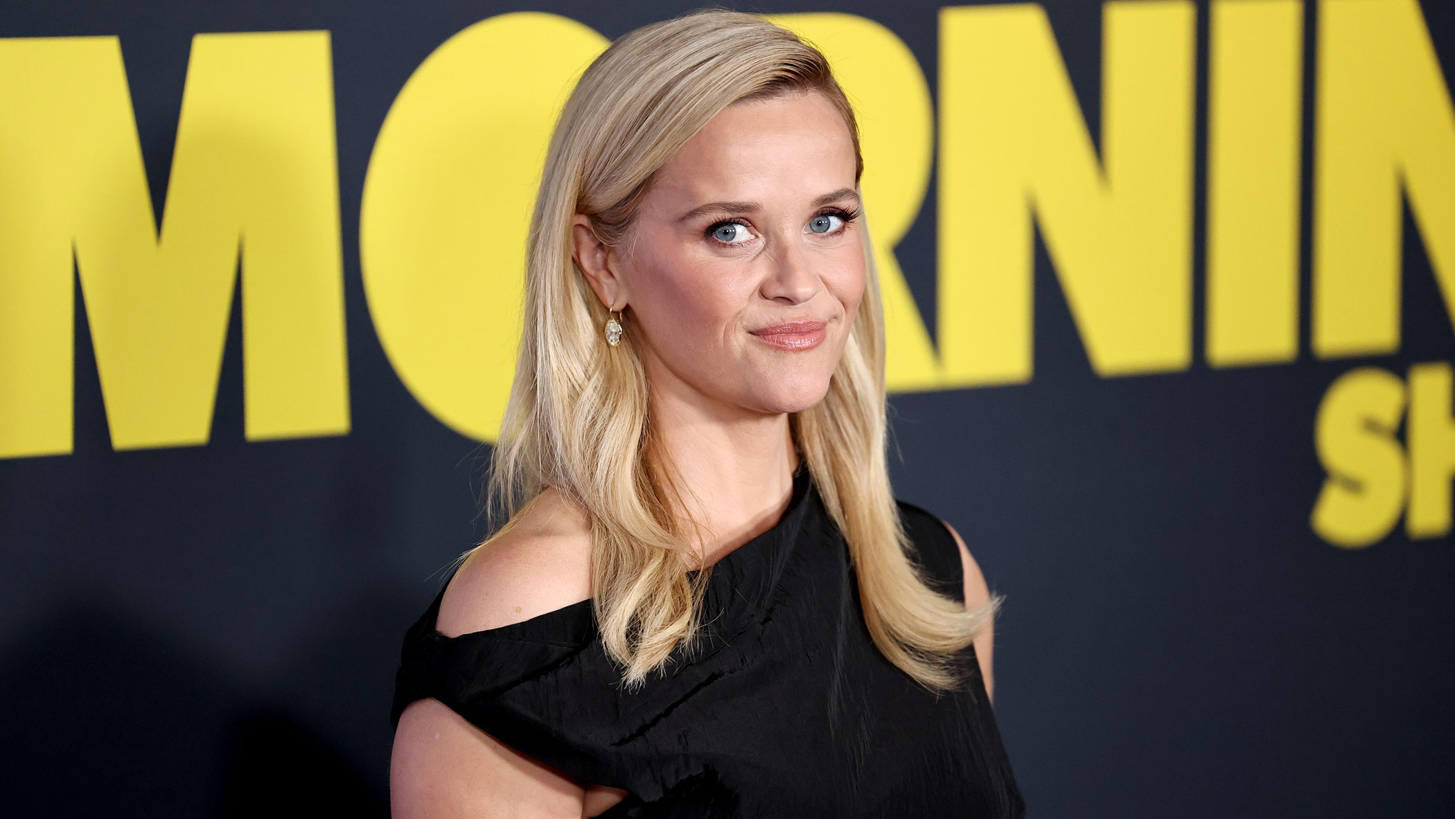 Reece Witherspoon wears a black top.