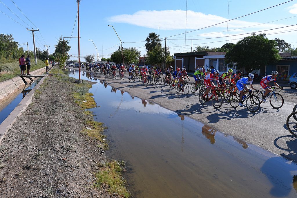 Fans watch road side as the peloton rolls by