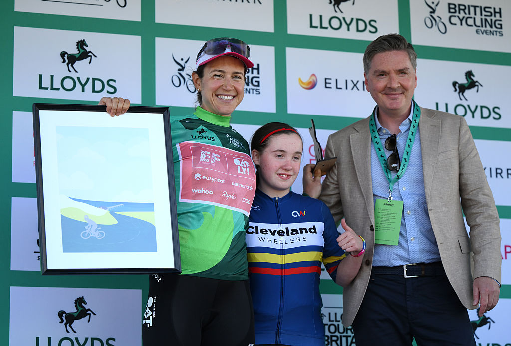 SALTBURNBYTHESEA ENGLAND JUNE 06 Kristen Faulkner of United States and Team EF EducationOatly celebrates at podium as Green Leader Jersey winner during the 10th Tour of Britain Women 2025 Stage 2 a 1143km stage from Hartlepool to SaltburnbytheSea UCIWWT on June 06 2025 in SaltburnbytheSea England Photo by Alex BroadwayGetty Images