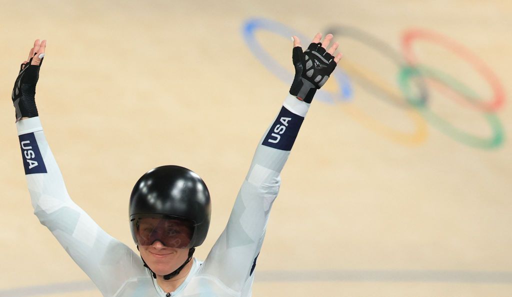 US' Jennifer Valente celebrates her victory after winning the women's track cycling omnium event of the Paris 2024 Olympic Games at the Saint-Quentin-en-Yvelines National Velodrome in Montigny-le-Bretonneux, south-west of Paris, on August 11, 2024. (Photo by Emmanuel DUNAND / AFP)