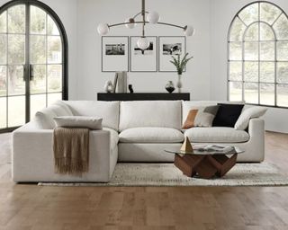 An off-white L-shaped sectional sofa in a modern living room