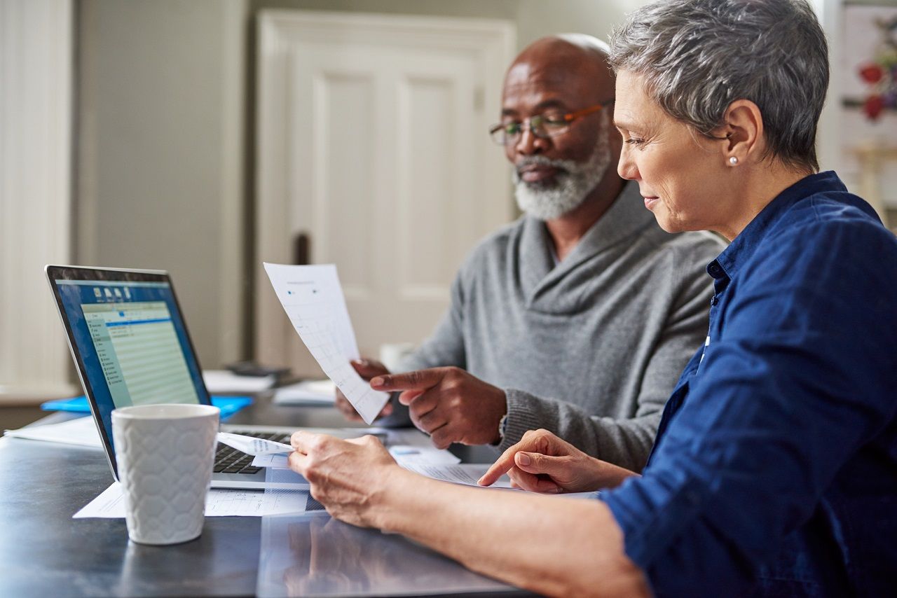 Cropped shot of a senior couple working on their finances at home