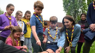 Princess Charlotte, Prince George, Prince Louis and Catherine, Princess of Wales toast marshmallows as they take part in the Big Help Out in 2023