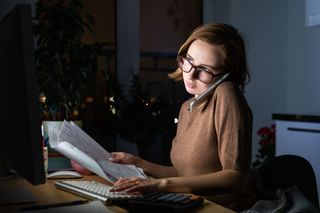 Woman working from home late into the night