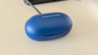 The Phiaton BonoBuds being charged via USB-C cable