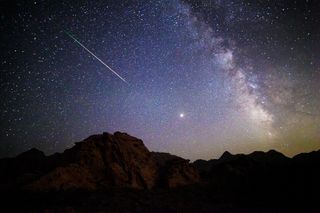 A Perseid meteor, Mars and the Milky Way light up the night sky in this photo taken near Las Vegas by Tyler Leavitt overnight on Aug. 12-13, 2018.