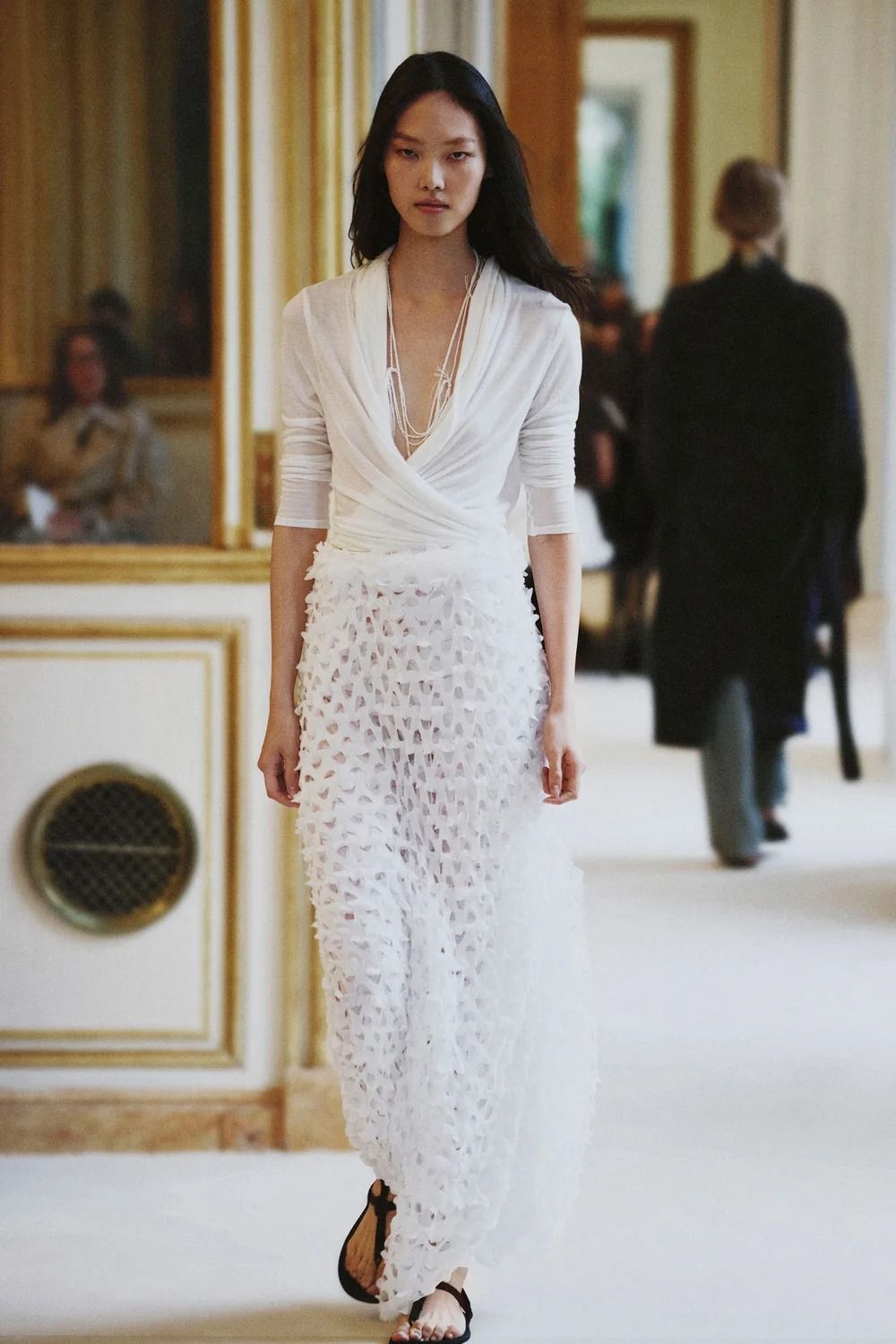 A model walking in The Row's Summer 2027 show during Paris Fashion Week.
