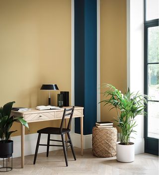 yellow and black stripe living area with desk