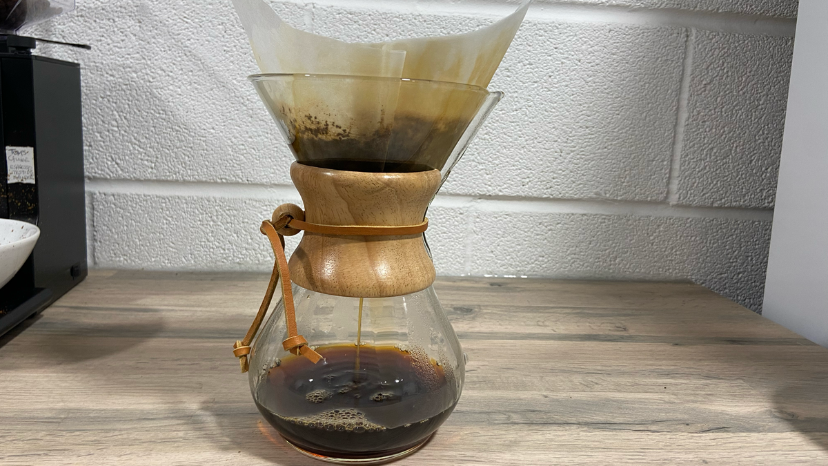 a chemex coffee maker being used to brew coffee