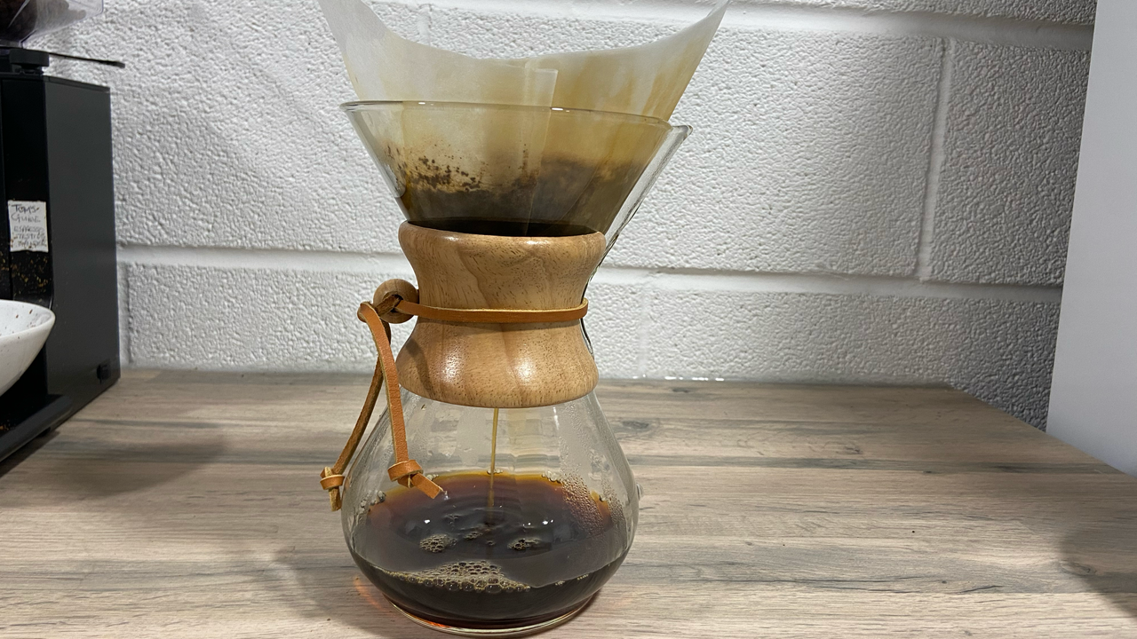 a chemex coffee maker being used to brew coffee