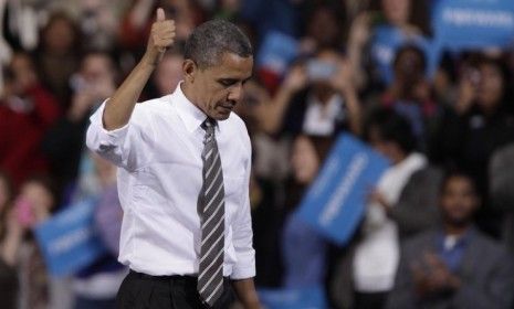 Obama gives a thumbs up after speaking to supporters at the Stroh Center on Sept. 26 in Bowling Green, Ohio. The president gets the thumbs up from most Americans, who say he&amp;#039;ll win the first 