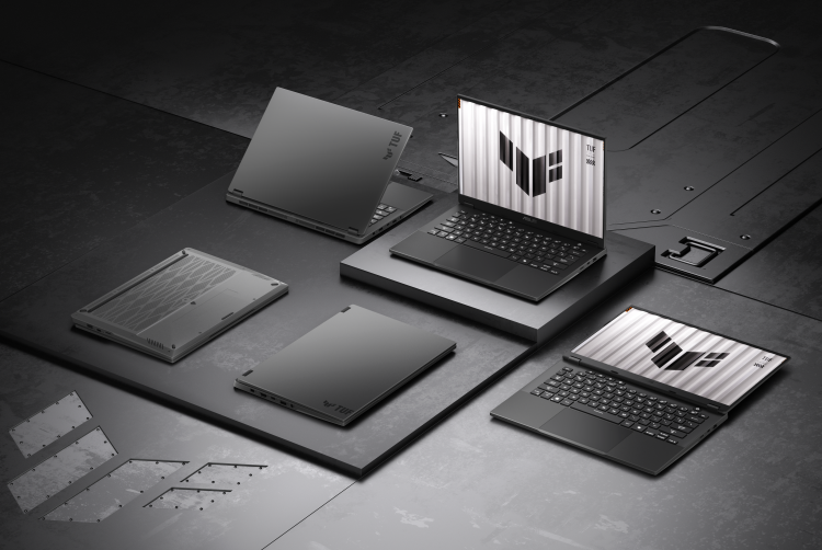 Multiple ASUS TUF Gaming A14 laptops displayed in various positions on an industrial metal surface, showcasing both open and closed designs with the TUF logo on screen and lids