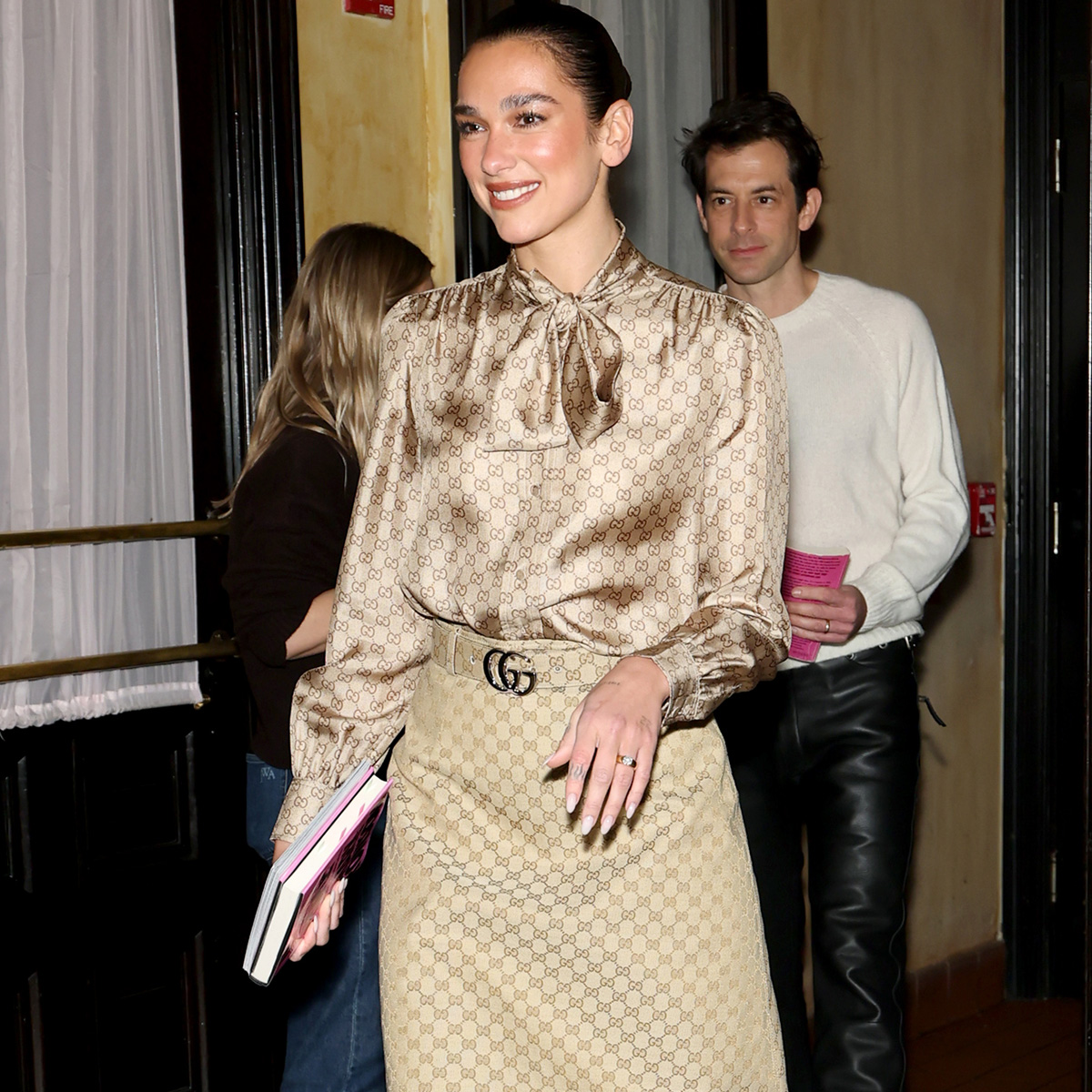 Dua Lipa wears Gucci's La Famiglia collection.