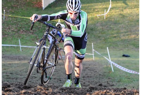 Jeremy Powers pushes his bike up the hill