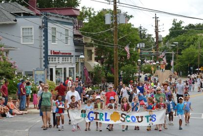 Girl Scouts in a parade.