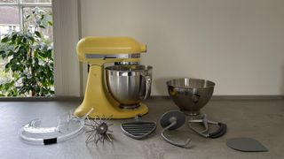 KitchenAid COTY Artisan 4.7L Stand Mixer with accessories on the counter