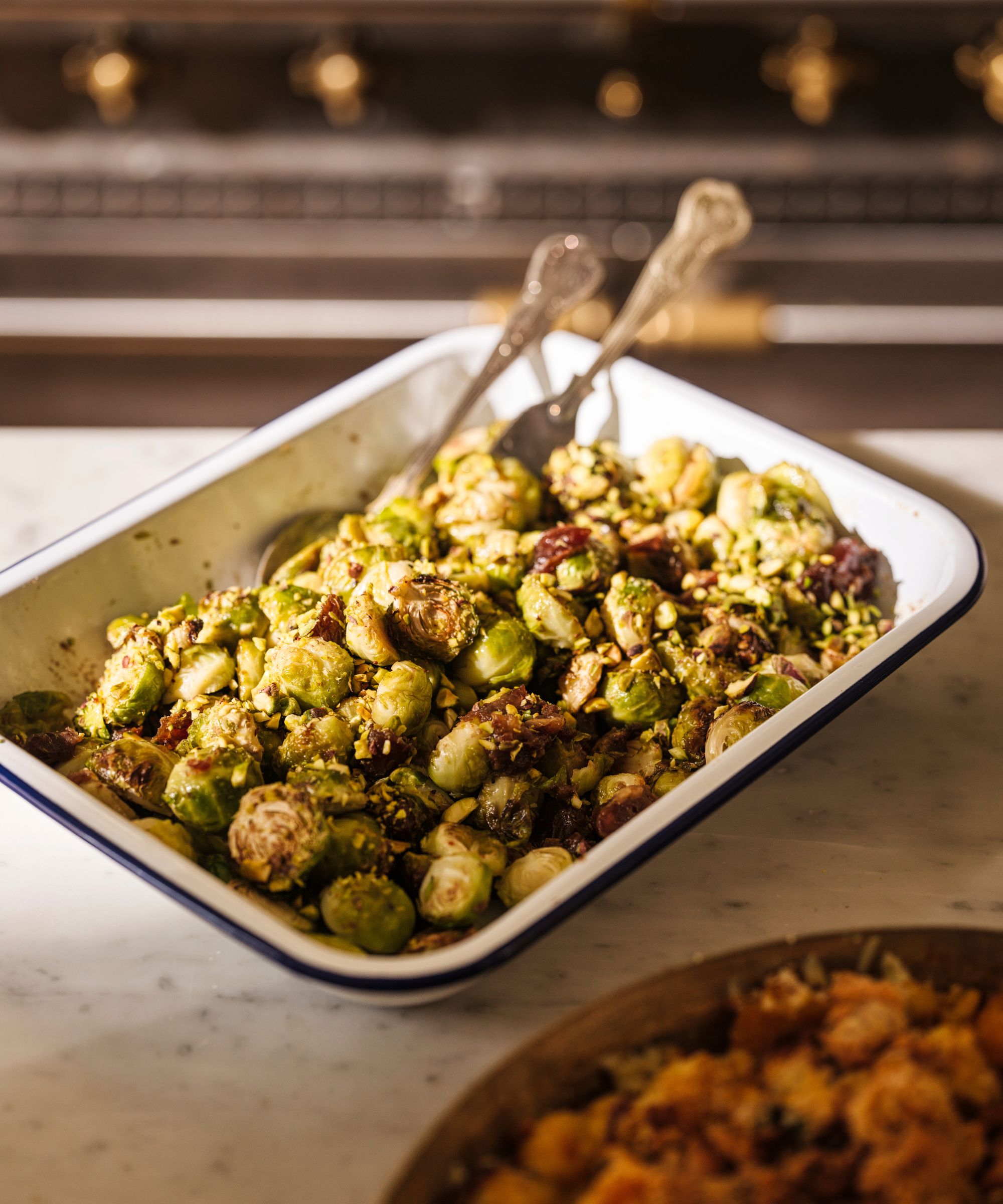 Roasted sprouts in a white enamel dish